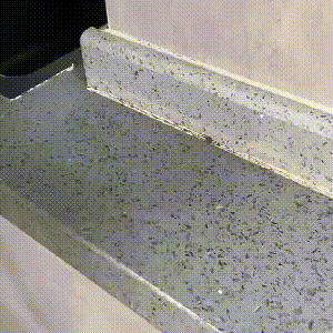 Woman enjoying a facial cleansing brush